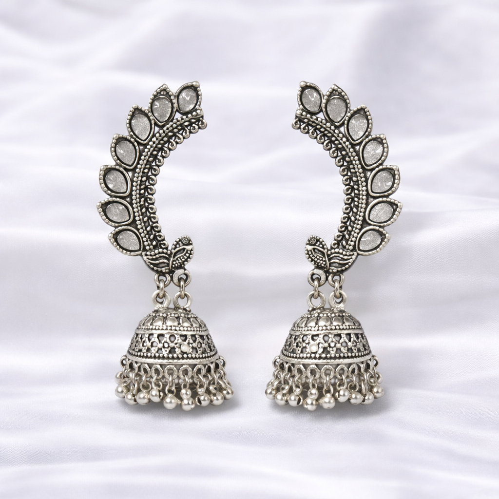 Intricately designed silver jhumka earrings