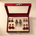 Multi-color jhumka earrings set on warm ivory paper