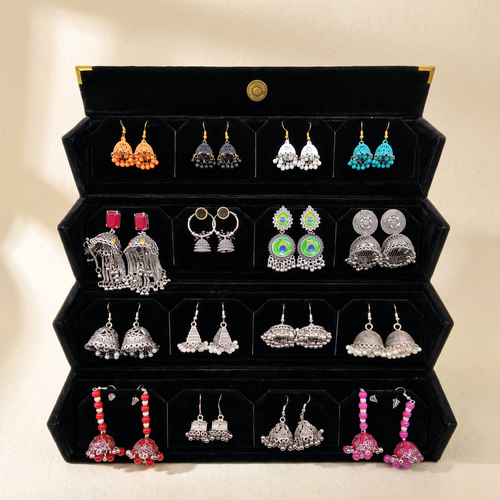 Silver and colorful jhumka collection box on warm ivory paper