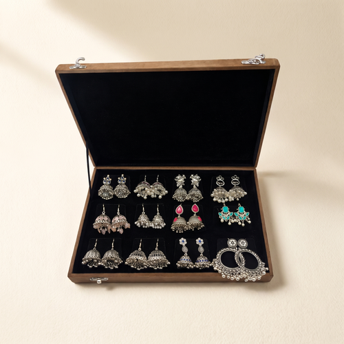 Oxidized jhumka earrings box on warm ivory paper
