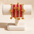 Gul-e-Zar Red & Gold Charm Bangle Set